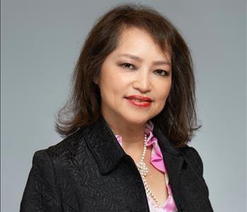 Profile photo of Trinh Le, female with dark hair and jacket