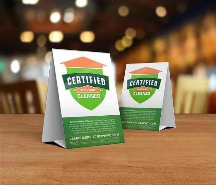 Certified: SERVPRO Cleaned decals on table